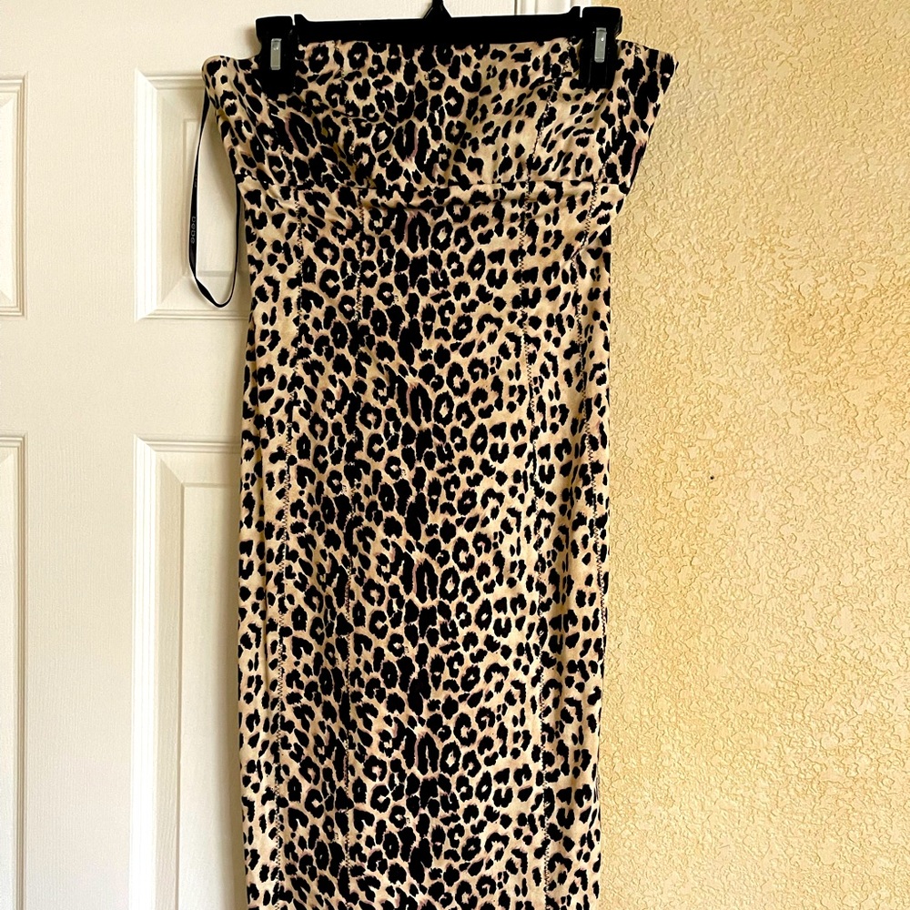 Bebe form fitting leopard pencil dress with slit in the back-